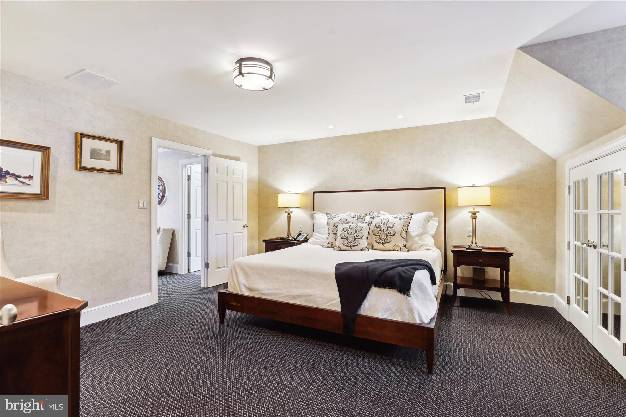 5008 Baltan Road Bethesda, MD 20816 - Photo 52 of 76 a bedroom with a bed couch and a window