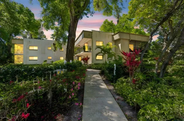 a view of a street with houses on both side