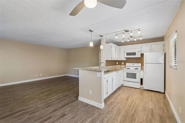 a view of an empty room and closet area