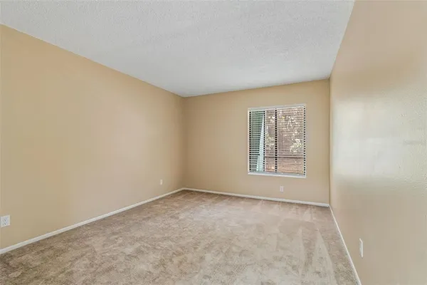 a view of wooden deck with a house and a park
