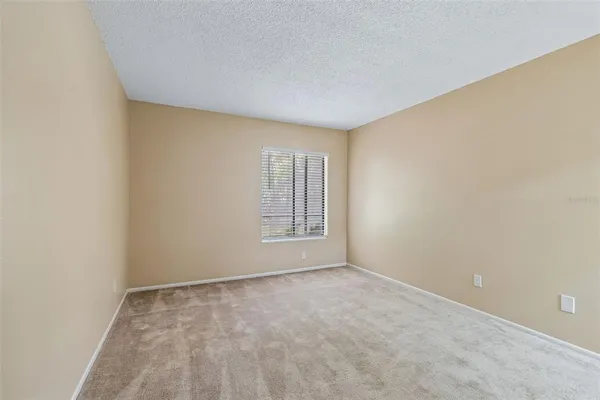 a sign that is on a brick wall