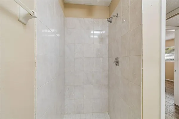 a view of a patio with couches table and chairs and potted plants