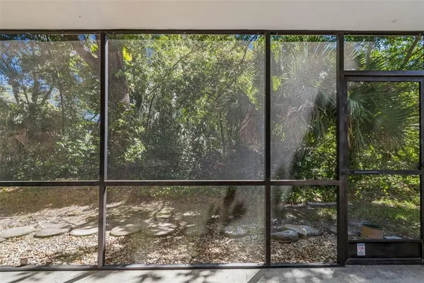 an aerial view of residential houses with outdoor space and street view
