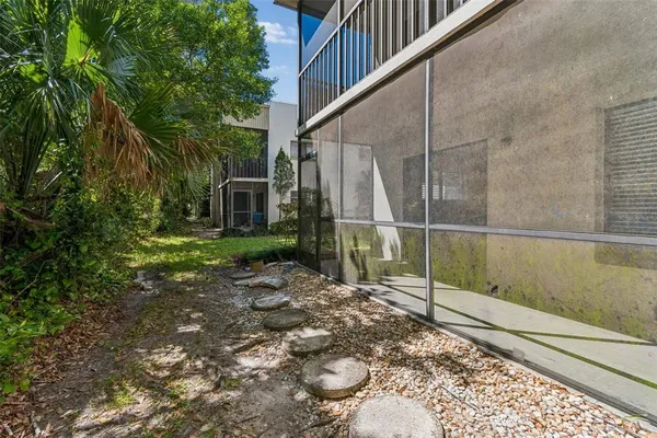 an aerial view of house with yard swimming pool and outdoor seating