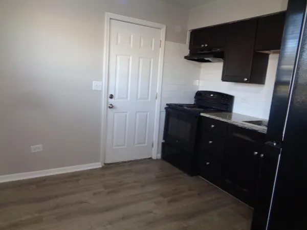 a view of a kitchen from the closet