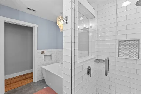 a view of an empty room and wooden floor