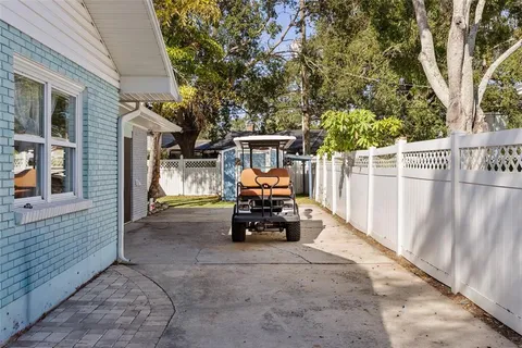 a view of a yard with flower plants
