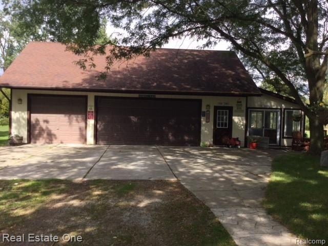 14955 28 Mile Road Washington, MI 48094 - Photo 42 of 51 OVERSIZED 3 CAR WITH ATTACHED SUNROOM