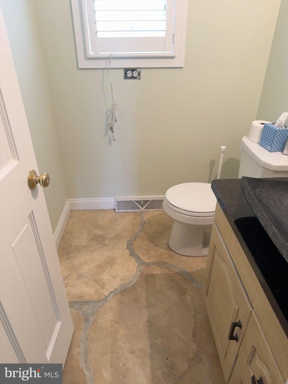 176 Griffith Street Salem, NJ 08079 - Photo 17 of 36 Charming bathroom with natural stone floor.