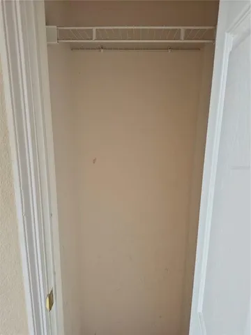 a room with water heater and cabinets