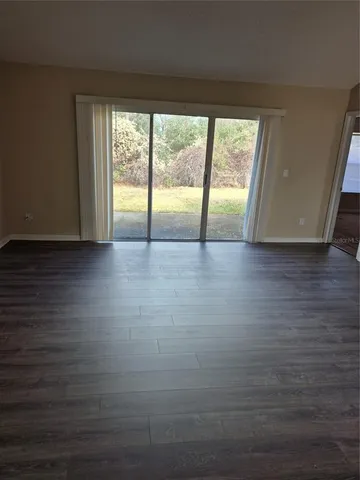 a view of a glass door with a yard