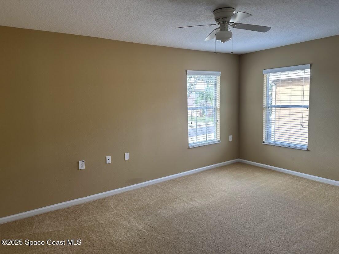 189 Wading Bird Circle Southwest Palm Bay, FL 32908 - Photo 19 of 23 a view of an empty room with a window