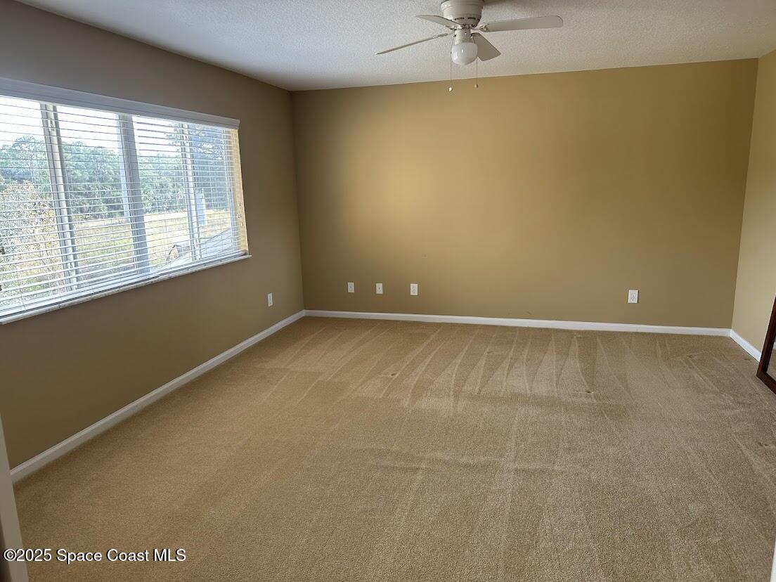 189 Wading Bird Circle Southwest Palm Bay, FL 32908 - Photo 21 of 23 a view of an empty room with a window