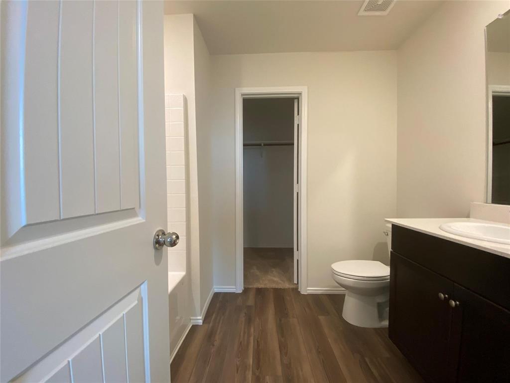 4408 Culrin Way Forney, TX 75126 - Photo 12 of 17 a bathroom with a sink toilet and shower