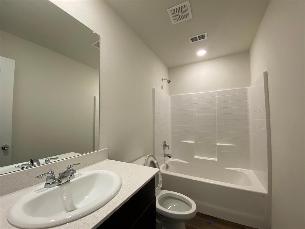 4408 Culrin Way Forney, TX 75126 - Photo 7 of 17 a bathroom with a sink a toilet and shower