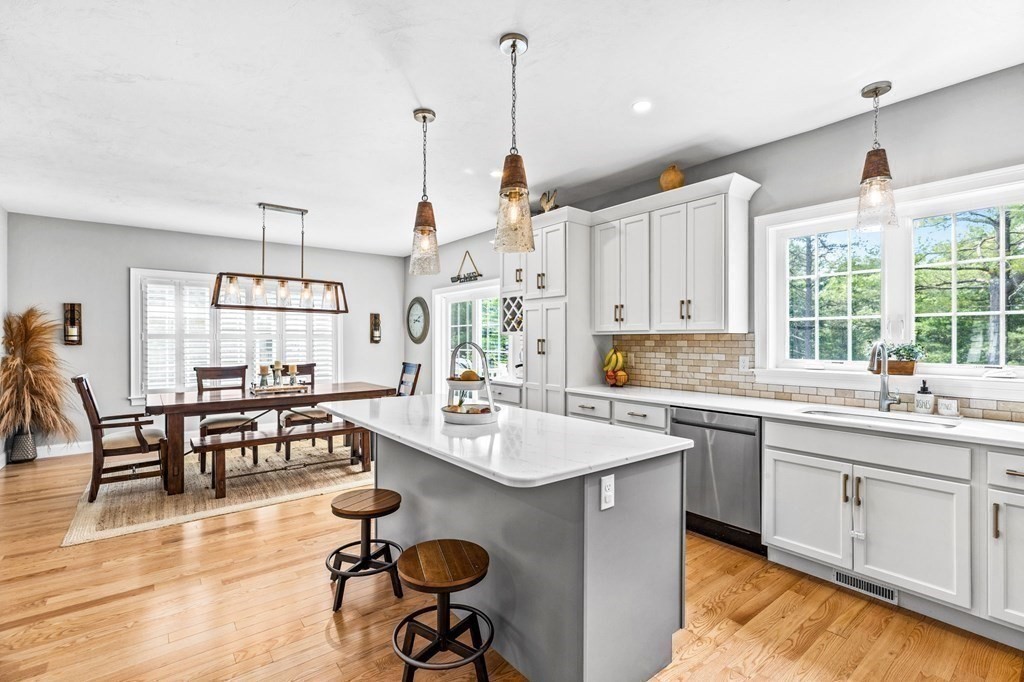 17 Farm Road Plymouth, MA 02360 - Photo 6 of 29 a open kitchen with sink cabinets dining table and chairs