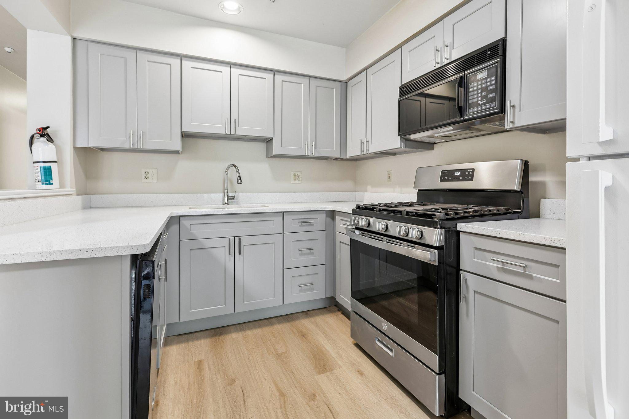624 Brickhouse Road Princeton, NJ 08540 - Photo 16 of 43 a kitchen with cabinets stainless steel appliances and a sink