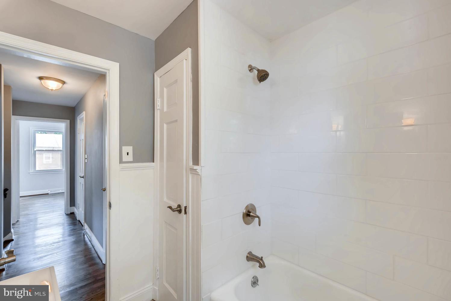 4823 Briarclift Road Baltimore, MD 21229 - Photo 17 of 30 a bathroom with a bathtub and a shower