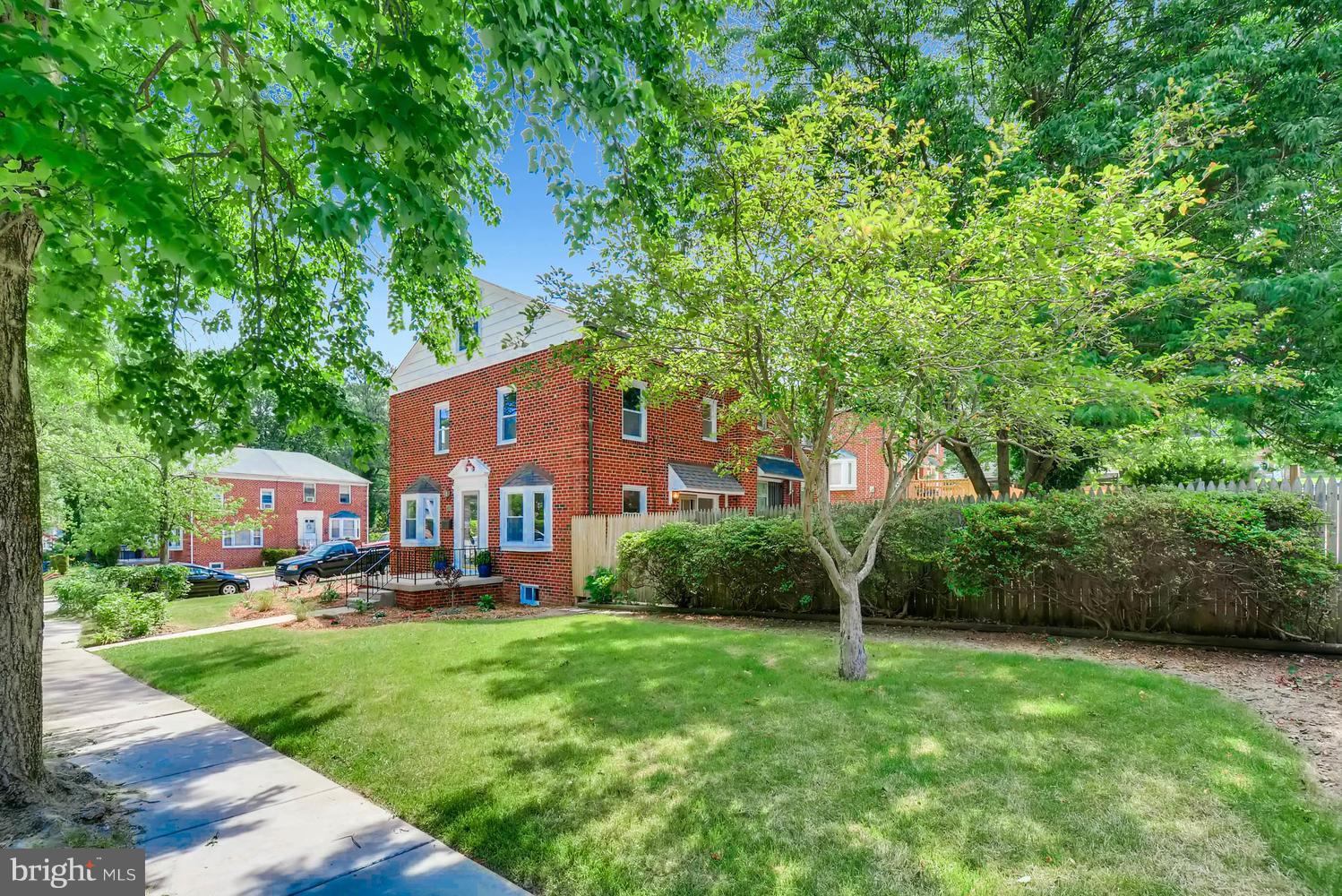 4823 Briarclift Road Baltimore, MD 21229 - Photo 3 of 30 a front view of a house with a yard and trees