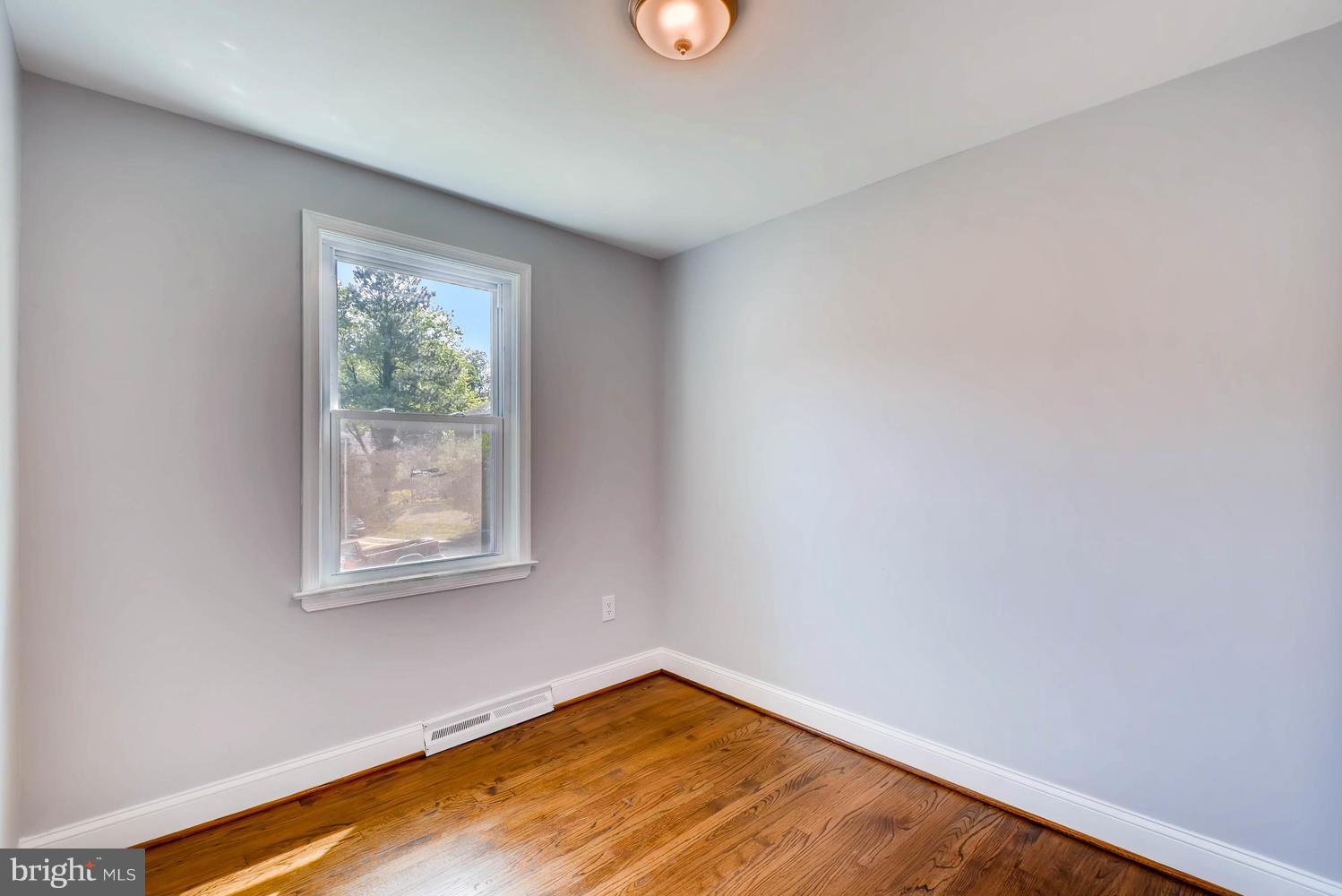 4823 Briarclift Road Baltimore, MD 21229 - Photo 23 of 30 an empty room with a window