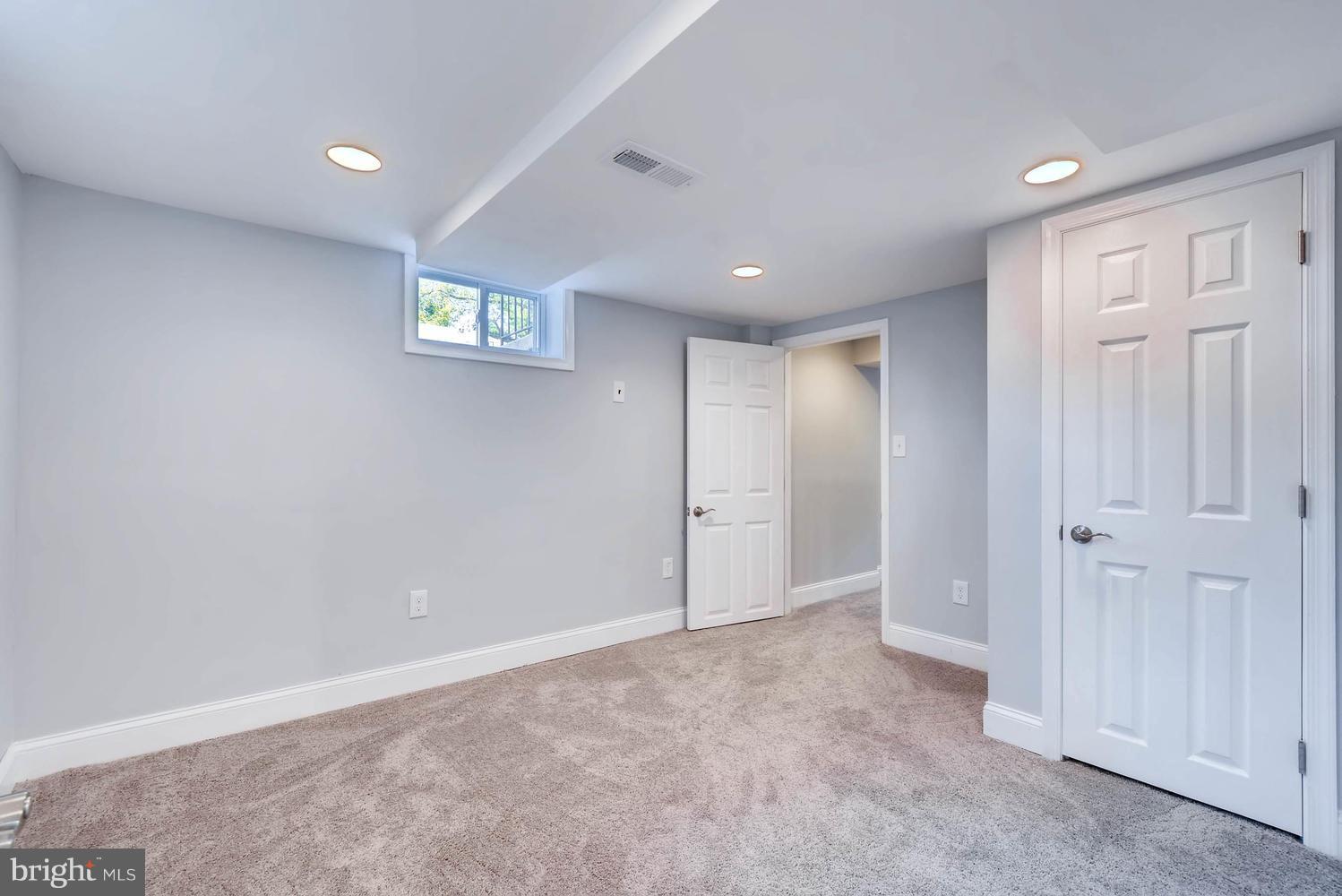 4823 Briarclift Road Baltimore, MD 21229 - Photo 27 of 30 a view of an empty room and a window