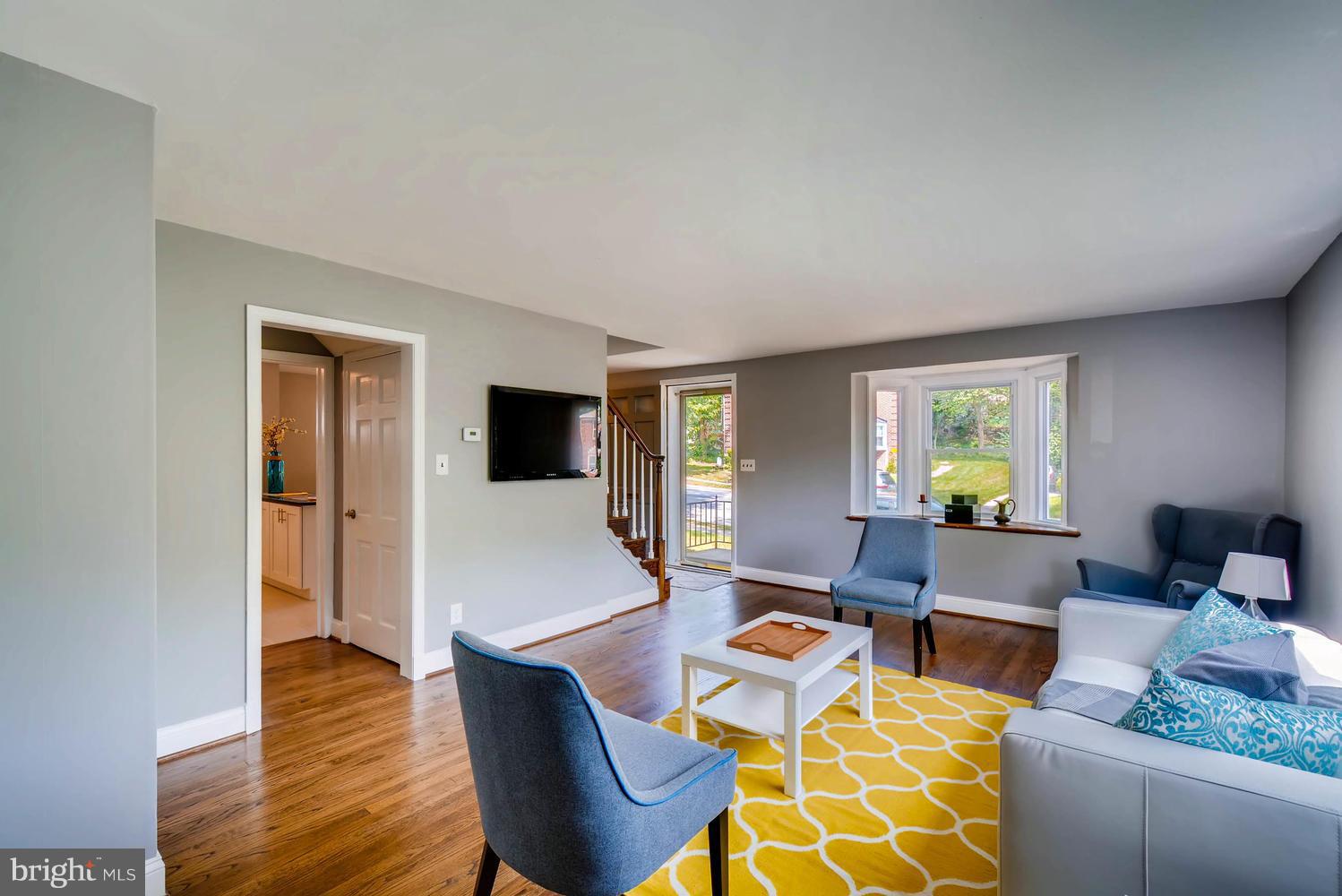 4823 Briarclift Road Baltimore, MD 21229 - Photo 5 of 30 a living room with furniture and a wooden floor