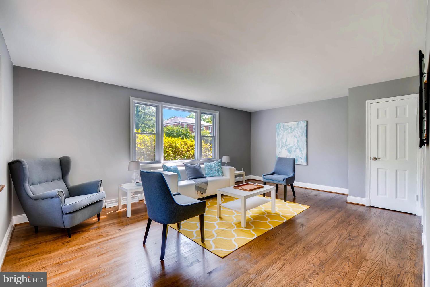 4823 Briarclift Road Baltimore, MD 21229 - Photo 6 of 30 a living room with furniture and a wooden floor