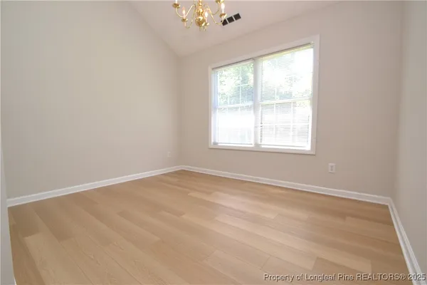a view of an empty room and window