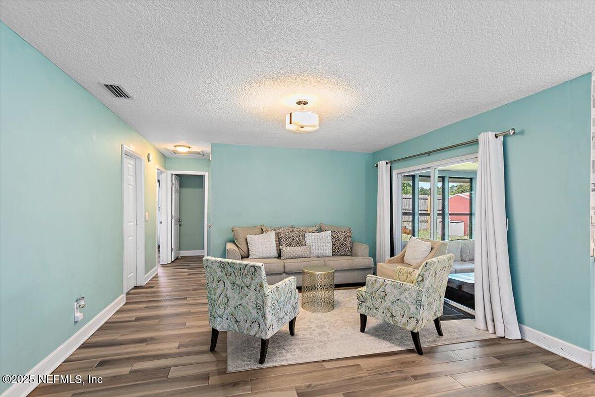 898 Perkins Place Jacksonville, FL 32221 - Photo 11 of 21 a living room with furniture and wooden floor