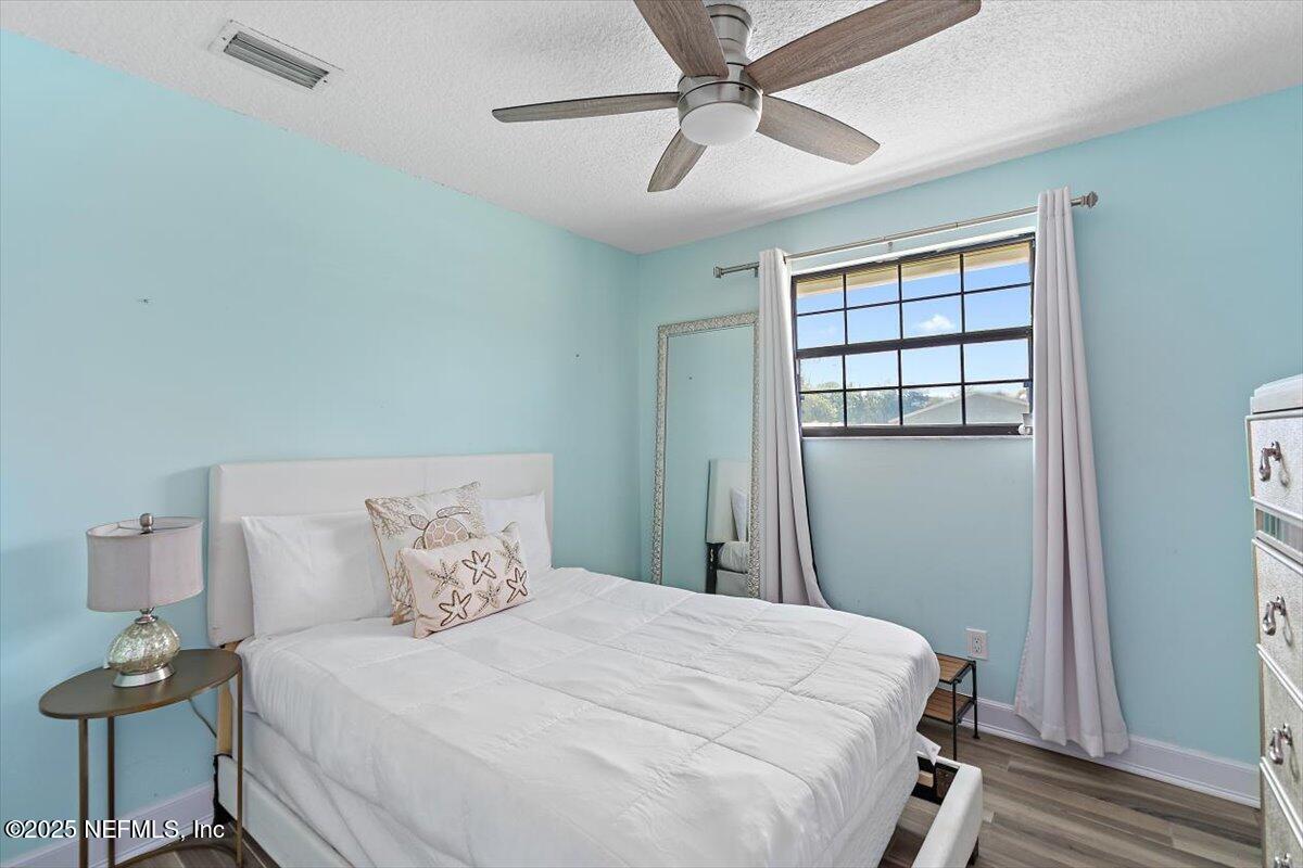 898 Perkins Place Jacksonville, FL 32221 - Photo 14 of 21 a bedroom with a bed and a window