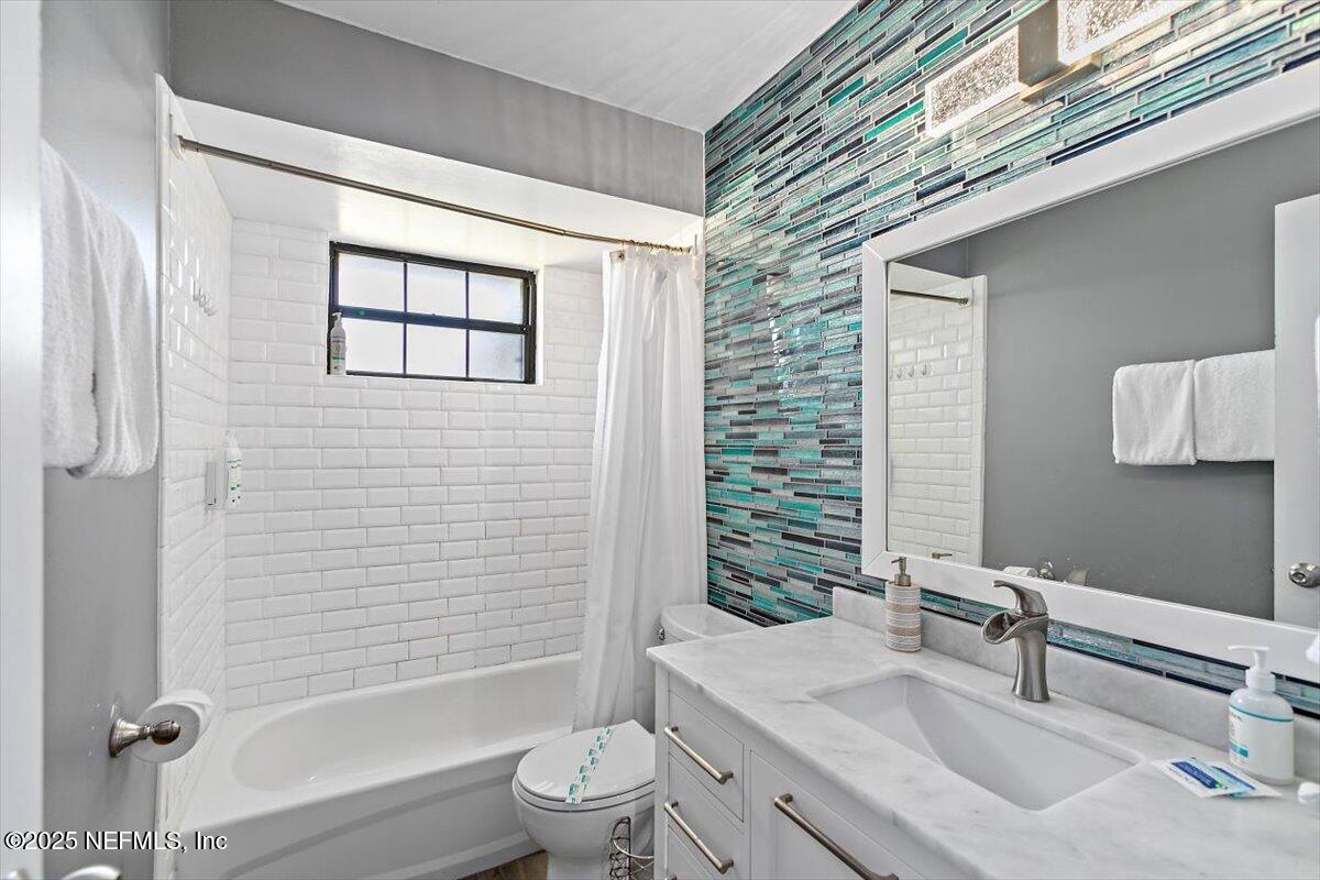 898 Perkins Place Jacksonville, FL 32221 - Photo 16 of 21 a bathroom with a sink toilet and shower