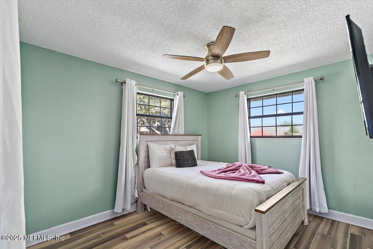 898 Perkins Place Jacksonville, FL 32221 - Photo 17 of 21 a bedroom with a bed and a window