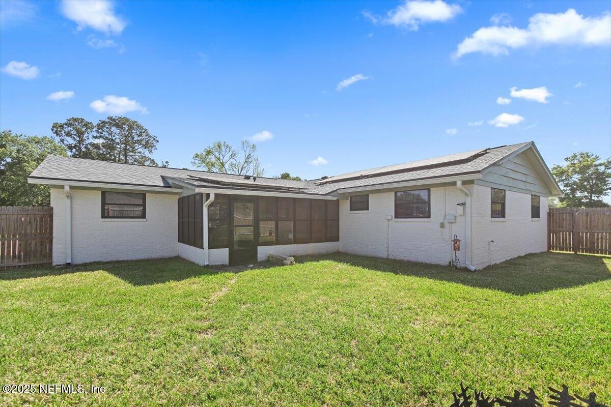 898 Perkins Place Jacksonville, FL 32221 - Photo 21 of 21 a view of a yard with a house