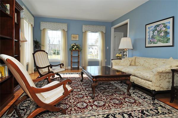 18 Wilkes Road Rowley, MA 01969 - Photo 11 of 29 a living room with furniture a rug and a window