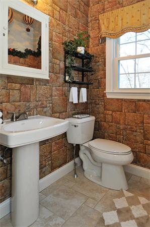 18 Wilkes Road Rowley, MA 01969 - Photo 14 of 29 a bathroom with a toilet sink and mirror