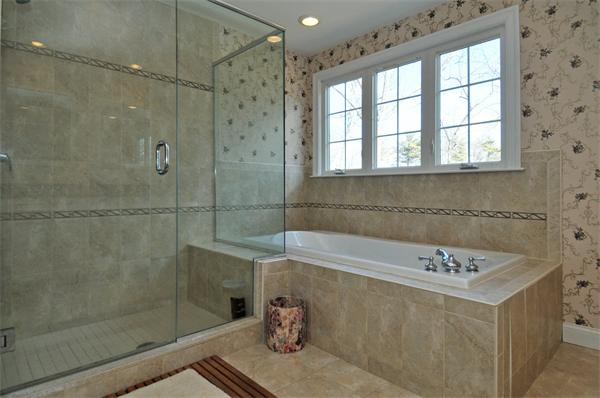 18 Wilkes Road Rowley, MA 01969 - Photo 19 of 29 a bathroom with a bathtub and a sink