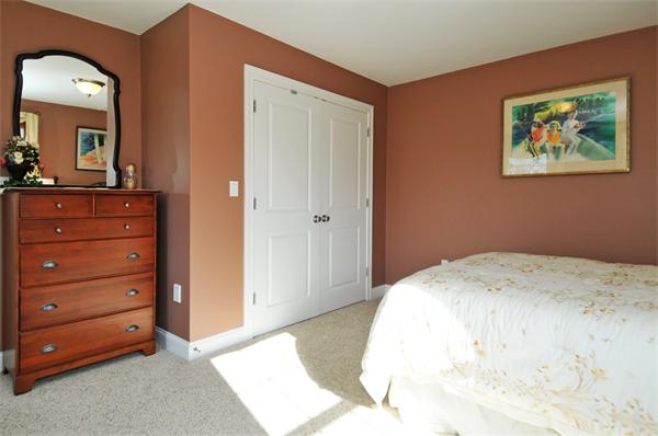 18 Wilkes Road Rowley, MA 01969 - Photo 22 of 29 a bedroom with a bed and a mirror on dresser