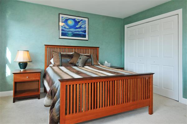 18 Wilkes Road Rowley, MA 01969 - Photo 25 of 29 a bedroom with a bed and a lamp on dresser