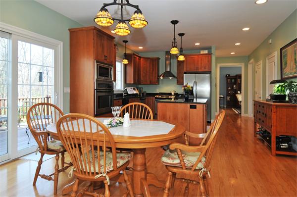 18 Wilkes Road Rowley, MA 01969 - Photo 6 of 29 a view of a dining room with furniture a chandelier and wooden floor