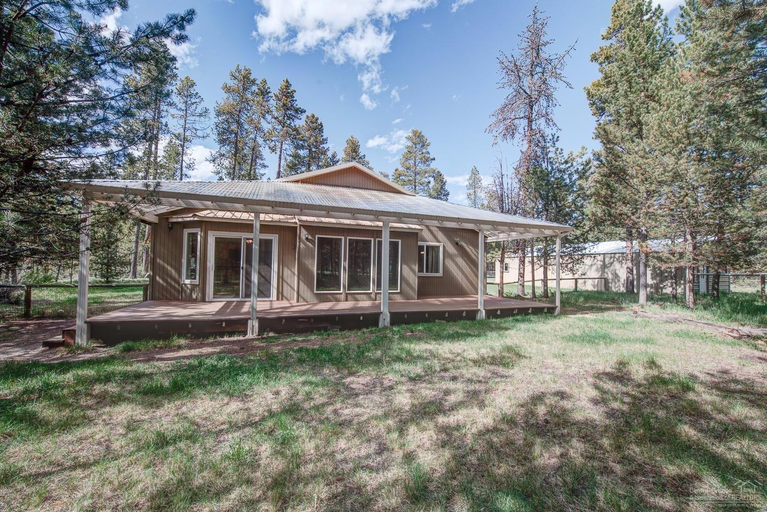 17265 Bakersfield Road Bend, OR 97707 - Photo 4 of 24 Full-length covered back deck with trans