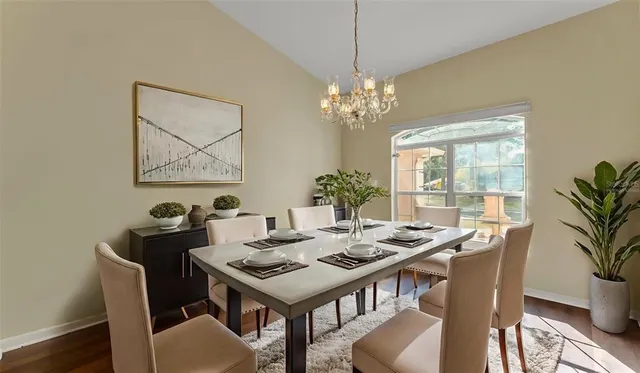 a view of a dining room with furniture window and wooden floor