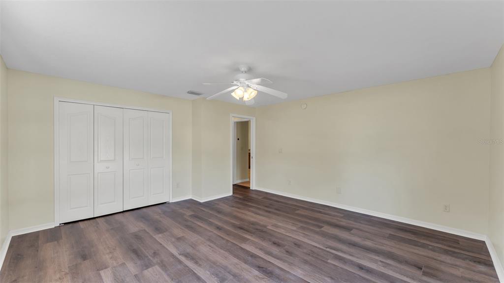 4647 Northeast 15th Street Ocala, FL 34470 - Photo 29 of 45 a view of a room with wooden floor and white walls