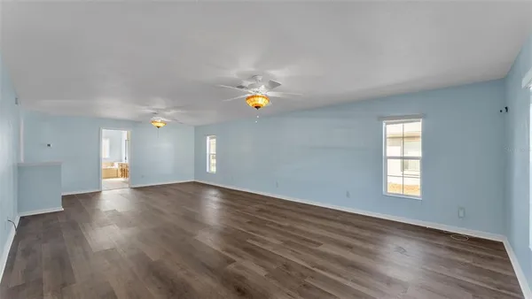 a view of an empty room and a window