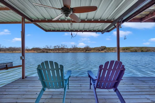 a balcony with furniture and wooden floor