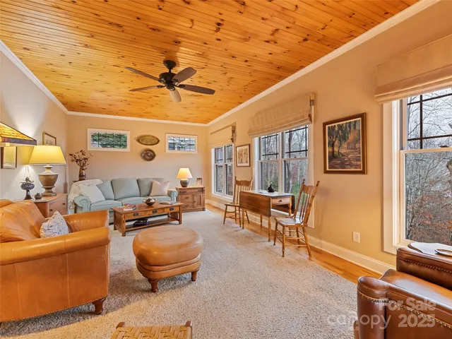 a living room with patio furniture and a window