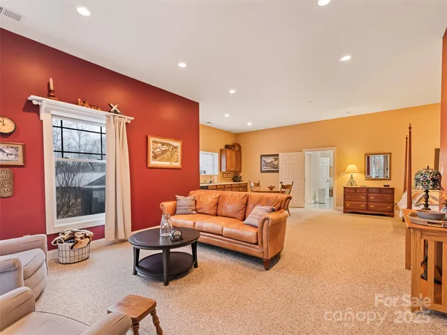 a living room with furniture a sink and a window