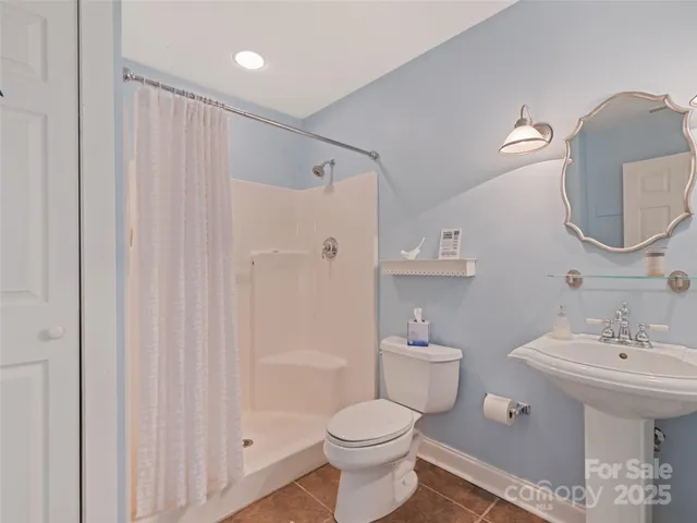 a room with storage and a ceiling fan