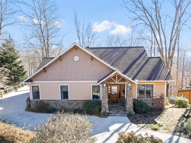 a house that has a tree in front of it
