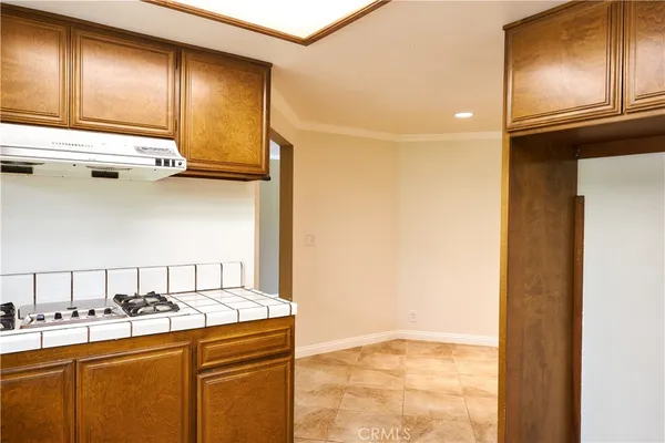 a kitchen with granite countertop a sink and a window
