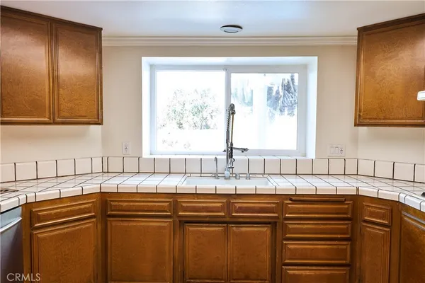 a kitchen with cabinets and appliances
